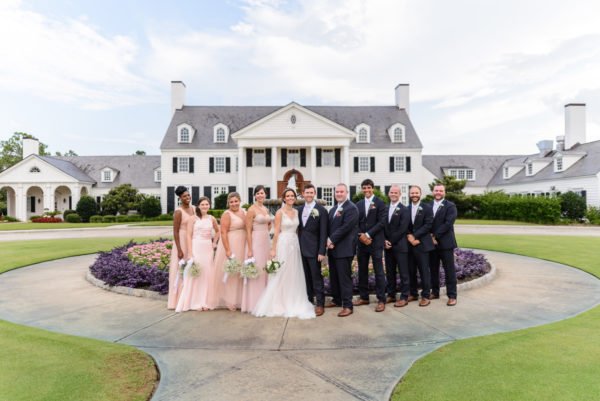 Bridal party standing in front of the fountain - Pine Lakes Country Club