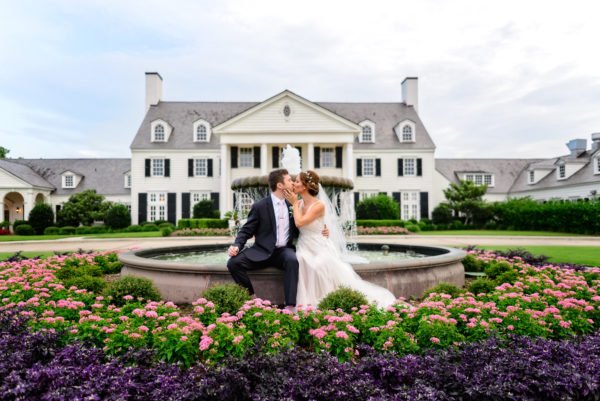 Couple kissing in front of the fountain - Pine Lakes Country Club