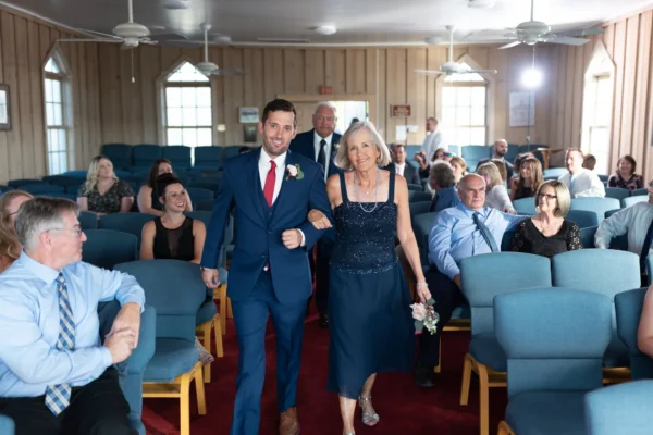 Groom and mother walking towards the ceremony - Pawleys Island Chapel