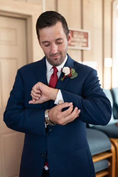 Groom fixing his cufflinks  - Pawleys Island Chapel