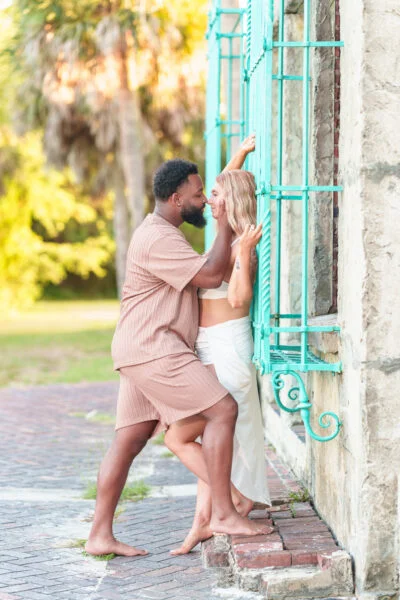 Couple beside the green ironwork at Atalaya Castle — Ryan Smith Photography