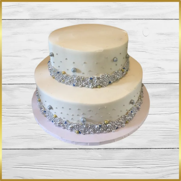 Two-tier pearl and ribbon wedding cake