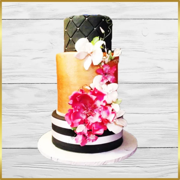 Black and gold wedding cake with orchids